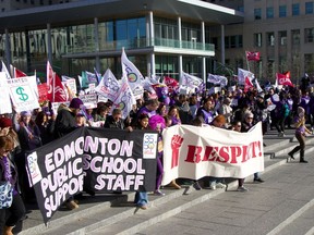 A collection of Alberta union members protest outside the Alberta legislature building in Downtown Edmonton on Thursday, Oct. 24, 2024.