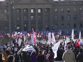 A collection of Alberta union members protest outside the Alberta legislature building in Downtown Edmonton on Thursday, Oct. 24, 2024.