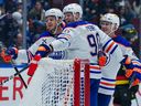 Corey Perry #90 of the Edmonton Oilers is congratulated after scoring a goal against the Vancouver Canucks during the second period of their NHL game at Rogers Arena on November 9, 2024 in Vancouver, British Columbia, Canada.