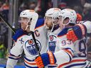 Edmonton Oilers captain Connor McDavid, left, Leon Draisaitl and Ryan Nugent-Hopkins celebrate Draisaitl's goal against the Vancouver Canucks at Rogers Arena on Saturday, Nov. 9, 2024.
