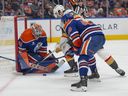 Goalie Stuart Skinner of the Edmonton Oilers stops Nicolas Roy of the Las Vegas Golden Knights at Rogers Place in Edmonton on Nov. 6, 2024.