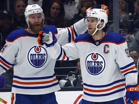 Connor McDavid of the Edmonton Oilers (right) celebrates the goal with Mattias Ekholm.