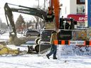 Construction crews work along Stony Plain Road at 156 Street in Edmonton on Tuesday, Feb. 11, 2025. The city wants to speed up road construction for the west leg of the Valley Line LRT along Stony Plain Road.