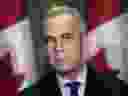 Prime Minister Mark Carney talks about the new tariffs imposed by U.S. President Donald Trump at a press conference in Kitchener, Ontario. Wednesday, March 26, 2025.