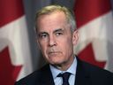 Prime Minister Mark Carney talks about the new tariffs imposed by U.S. President Donald Trump at a press conference in Kitchener, Ontario. Wednesday, March 26, 2025.