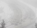 Motorists crossed the Capilano Bridge as the snow continued to fall in Edmonton on Thursday, March 27, 2025.
