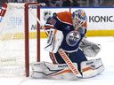 Edmonton Oilers goalkeeper Calvin Pickard (30) made a save against the San Jose Sharks in stage 2 of the second phase at Roger Place in Edmonton on Friday, April 11, 2025. David Bloom