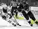 In the first phase of the NHL hockey game in Los Angeles on Saturday, April 5, 2025, Anze Kopitar drives the puck past Edmonton Oiler right-wing Connor Brown.