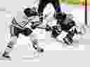 Connor McDavid of the Edmonton Oilers (97) passed Winnipeg Jets goalkeeper Eric Comre (1) during the first phase of the NHL action in Winnipeg Sunday, April 13, 2025.