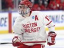 Quinn Hutson of Boston University (17) took action against Ohio State in an NCAA College hockey game in Toledo, Ohio on March 27, 2025.