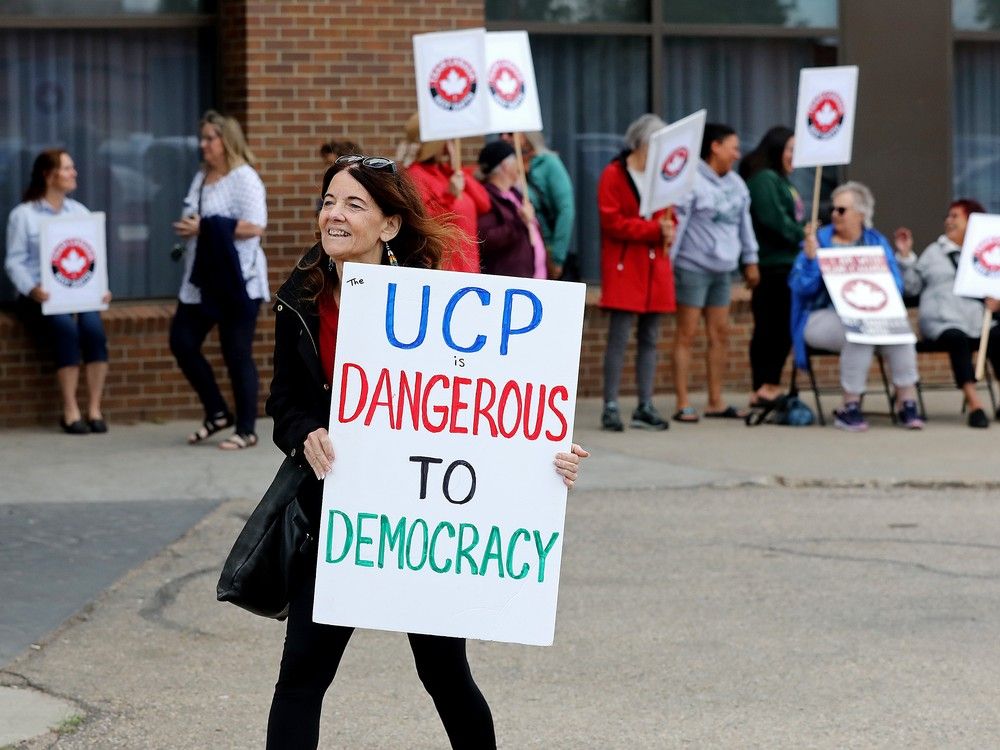  Protesters rally outside an Alberta Next Panel in-person town hall, in Edmonton Thursday Aug. 14, 2025.