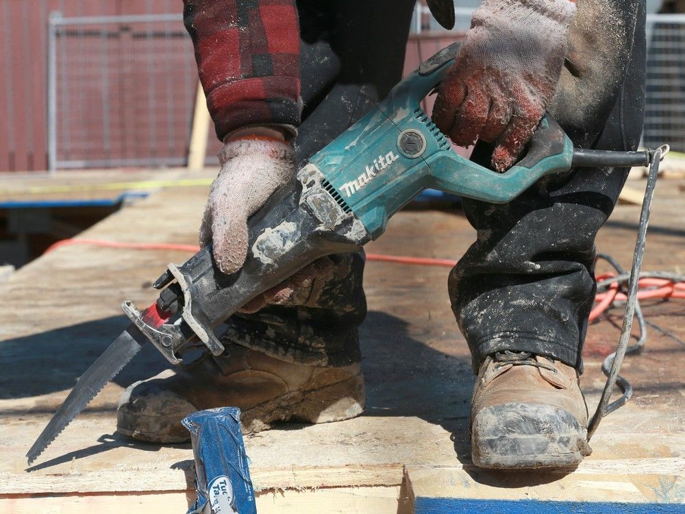 A construction worker at a residential jobsite is seen in northeast Calgary on April 4, 2025.