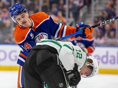 The Edmonton Oilers' Connor Clattenburg (64) battles the Dallas Stars' Radek Faksa (12) during third period NHL action at Rogers Place, in Edmonton Tuesday Nov. 25, 2025. The Stars won 8 to 3.