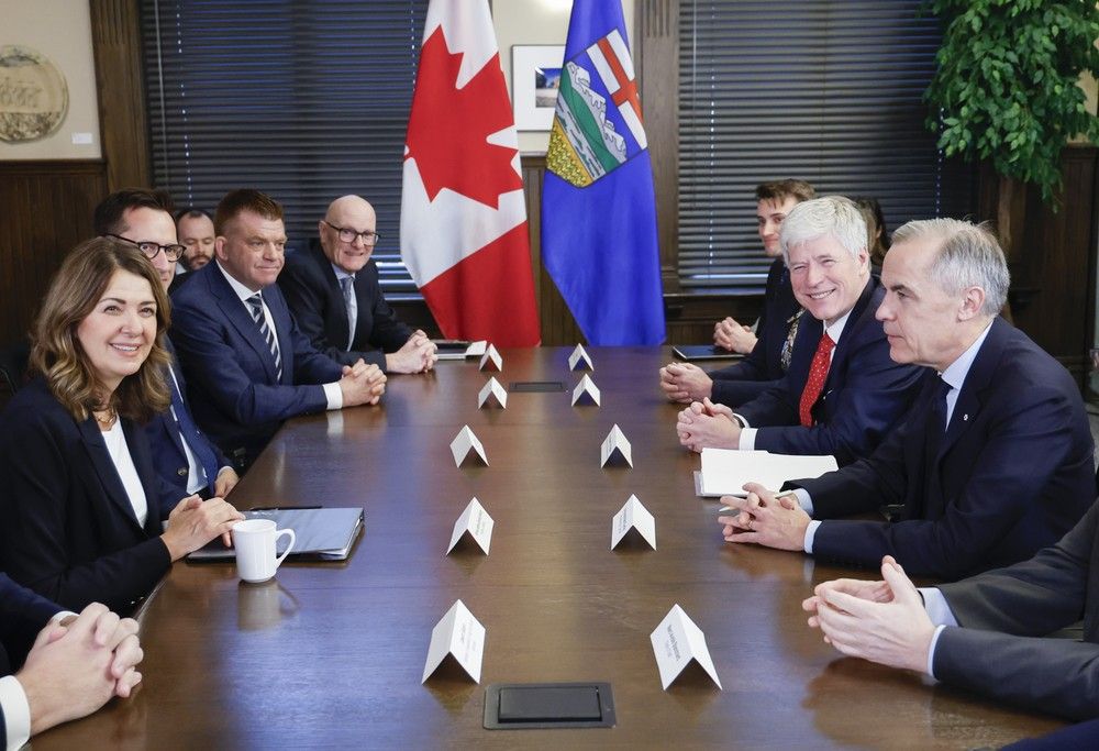 Prime Minister Mark Carney, right, meets with Alberta Premier Danielle Smith in Calgary on Thursday, Nov. 27, 2025. Prime Minister Mark Carney, right, meets with Alberta Premier Danielle Smith in Calgary on Thursday, Nov. 27, 2025.