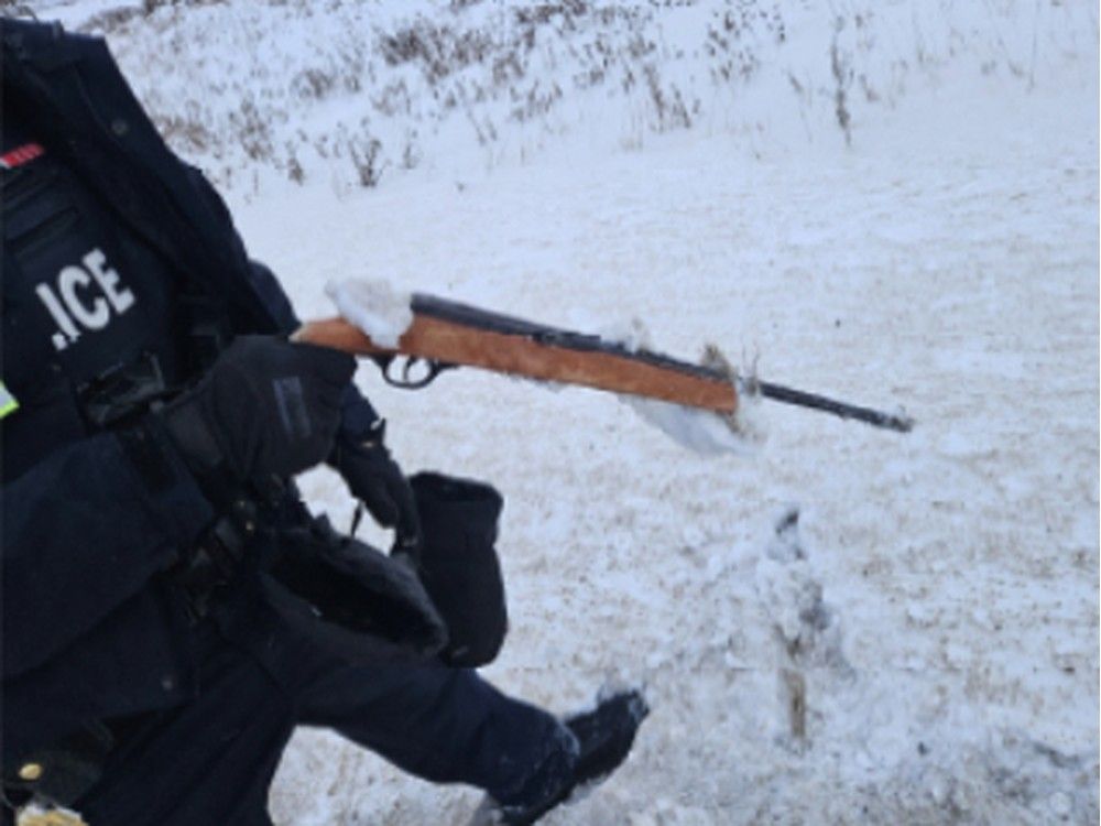 Two men are facing drug and firearms charges after police deployed a spike strip to stop a fleeing vehicle near the Saskatchewan border.