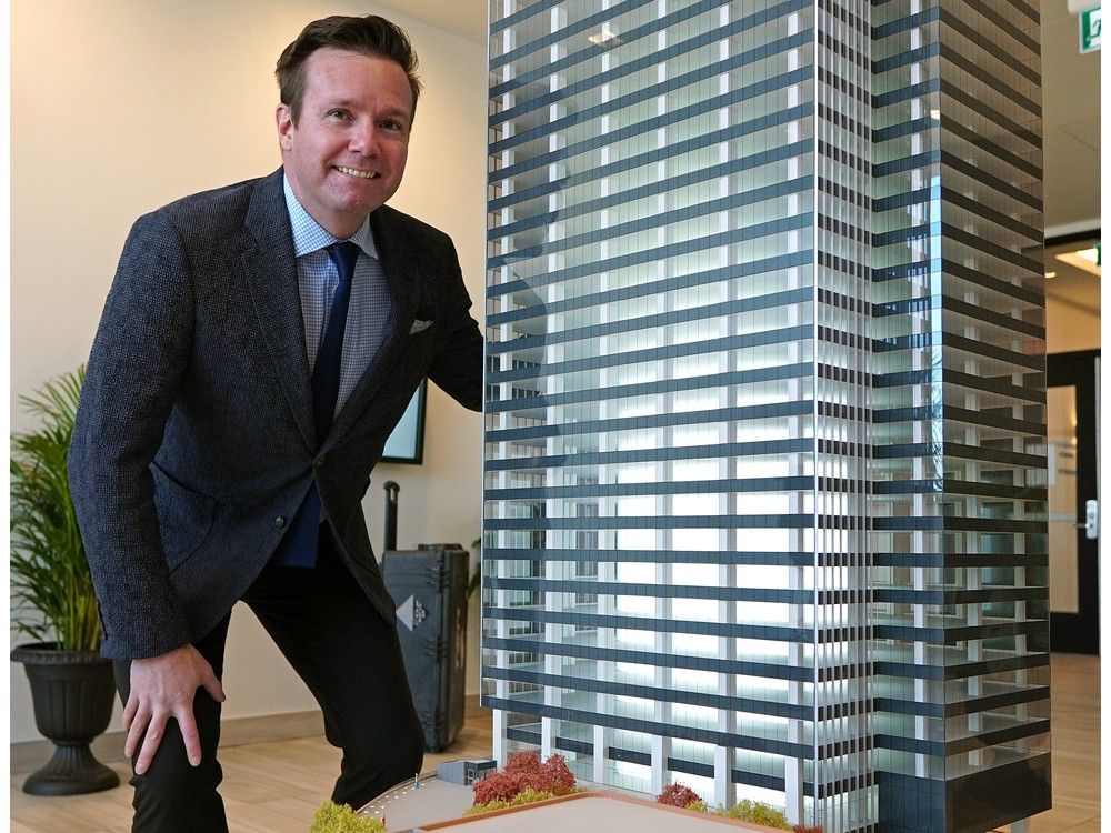  Tim Shipton, senior vice-president, communications, at Oilers Entertainment Group, beside a scale model of the Stantec Tower, where he announced on Tuesday, Oct. 20, 2020, that units at the SKY Residences in Stantec Tower were available for rent, mainly due to the economic climate created by the COVID-19 pandemic. The Downtown Edmonton luxury suites are located in the Ice District across the street from Rogers Place. The Stantec Tower is Western Canada’s tallest building.