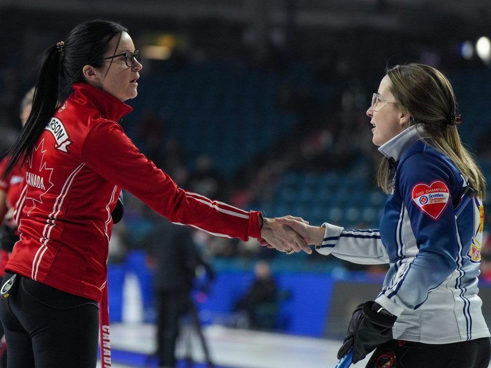 Skips Kerri Einarson (left) and Christina Black shake hands after a game at the Scotties Tournament of Hearts in Kamloops, B.C., on Feb. 25, 2023. Both are back at the 2026 event in Mississauga, Ont., and their teams are strong title contenders.