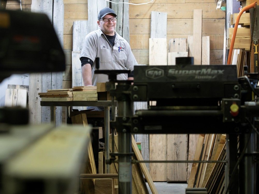 Backroads Reclamation co-owner Jay Sanderson in his workshop east of Edmonton on Friday, Jan. 2, 2026. Backroads Reclamation is working to take reclaimed wood from the city's old buildings and turn it into a consistent construction lumber supply.