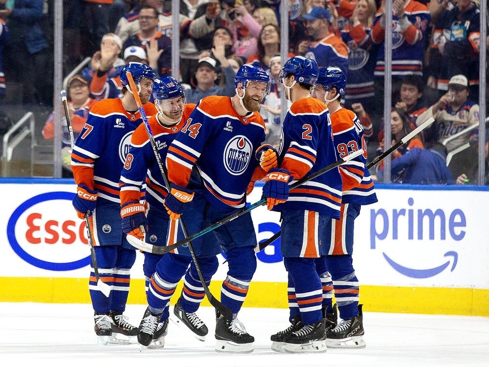The Edmonton Oilers' Mattias Ekholm (14) celebrates a goal against the Anaheim Ducks