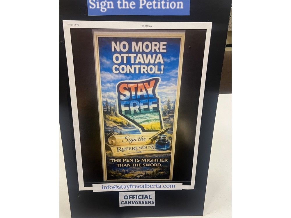  A sign at Red Deer’s Festival Hall on Wednesday, Jan 14, 2026, beseeches attendees to sign the referendum petition during the Alberta Prosperity Project’s town hall.