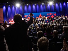 Two men jump up and cheer as Conservative Leader Pierre Poilievre speaks at the National Conservative Convention in Calgary on Friday, January 30, 2026.