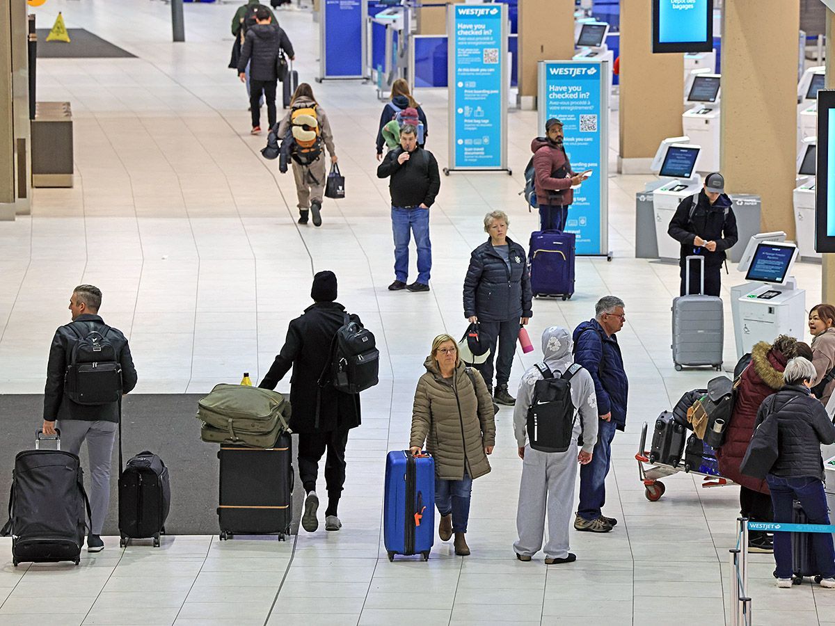 Travellers move through the Calgary International Airport on Dec. 9, 2025. Today's flying experience doesn't compare to how things used to be.