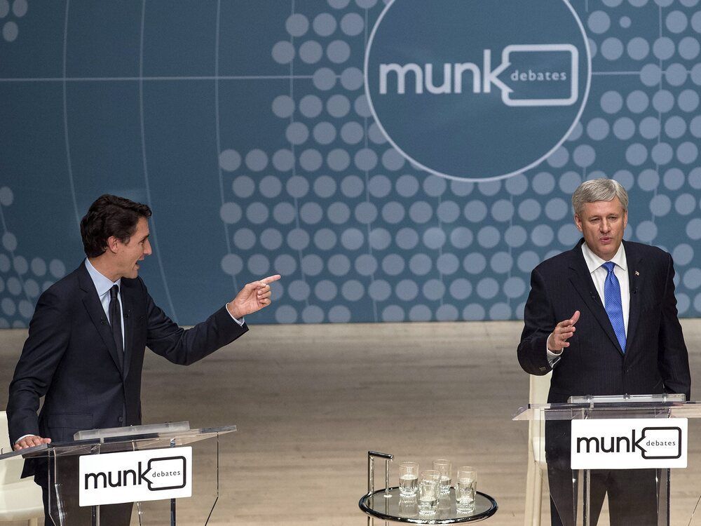 Liberal Leader Justin Trudeau, left, and Conservative Leader Stephen Harper trade words during the Munk Debate on foreign affairs in Toronto on Sept. 28, 2015.