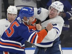 Edmonton Oilers defenceman Darnell Nurse and Toronto Maple Leafs defenceman Brandon Carlo fight during the second period on Feb. 3, 2026.