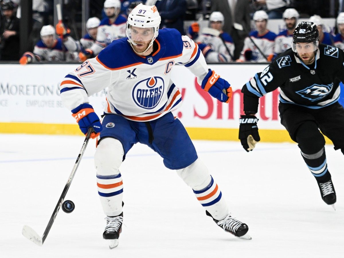 Connor McDavid #97 of the Edmonton Oilers moves the puck during the second period of a game against the Utah Mammoth