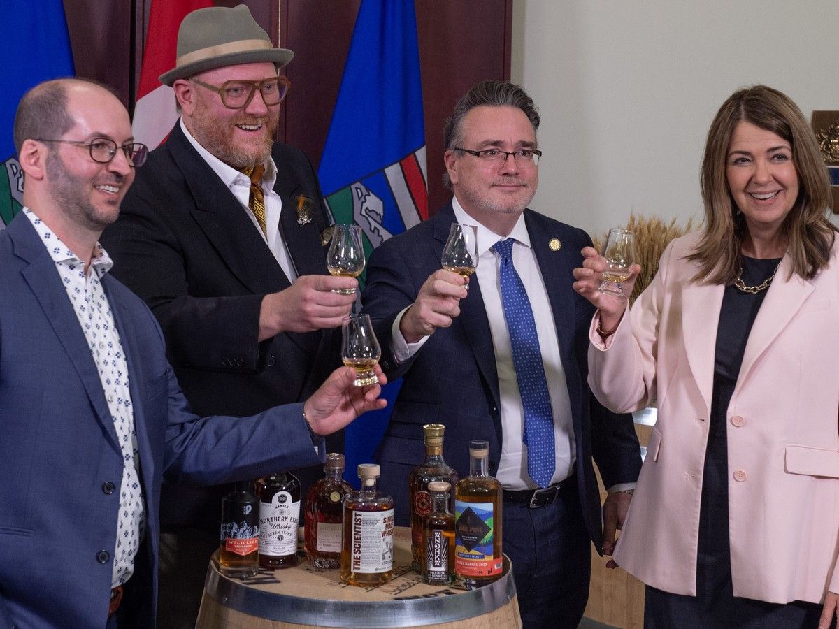 WhiskyPremier Danielle Smith and Minister of Service Alberta and Red Tape Reduction Dale Nally will introduce legislation to define and protect what can be labelled as "Alberta Whisky." on Tuesday, March 31, 2026. They were joined by Bryce Parsons, president and chair, Alberta Craft Distillers Association (in the hat) and Jordan Ramey, chief operations officer, Burwood Distillery.