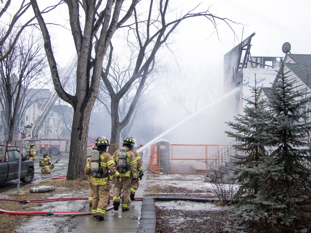 Firefighters doused a three story multi-plex in Garneau with water after a fire was spotted on the top floor. The two adjacent homes suffered heavy water damage after they were evacuated in Edmonton on Thursday, March 19, 2026.