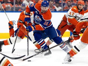 The Edmonton Oilers' Jason Dickinson (16) battles the Anaheim Ducks during first period NHL playoff action at Rogers Place, in Edmonton Monday April 20, 2026. The Oilers won 4-3.