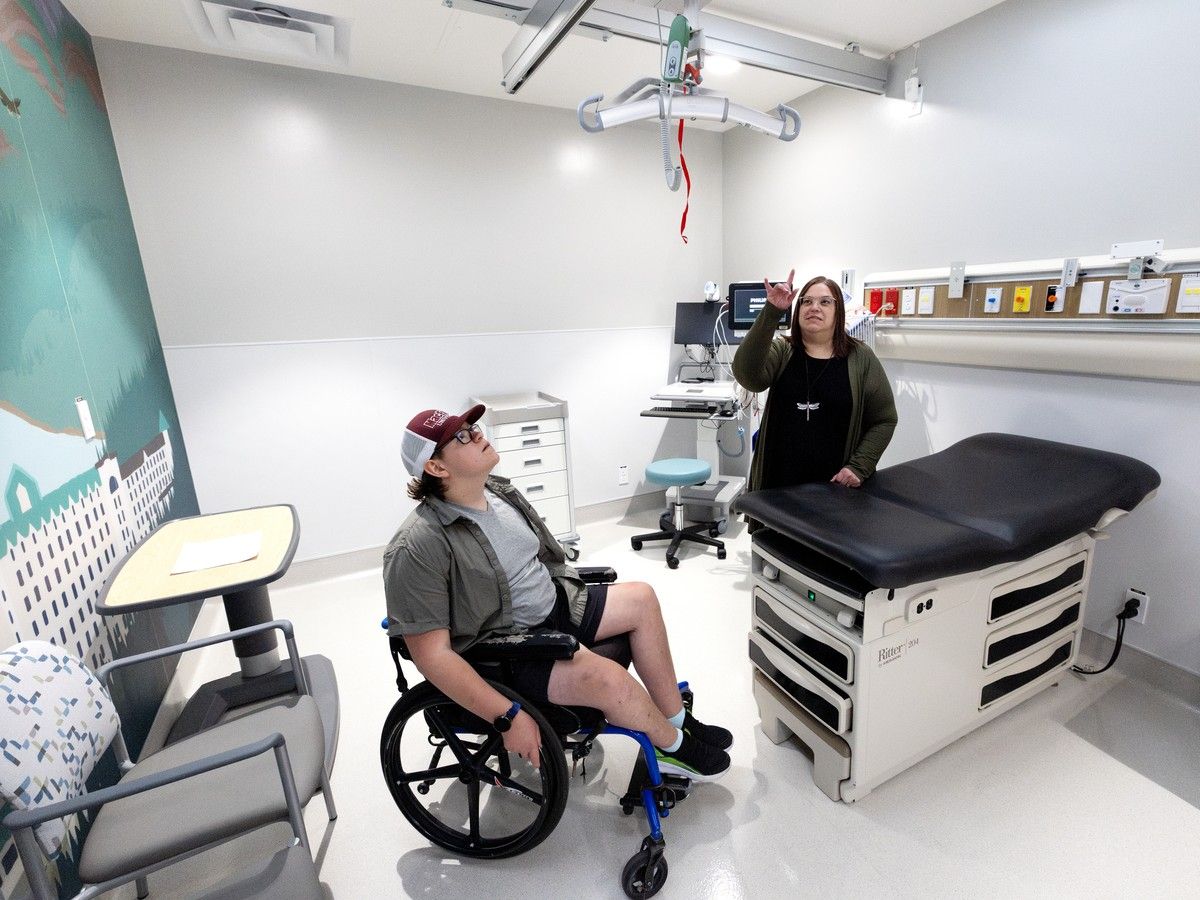 Dana Nagel and her son Cameron Nagel, 16, tour a procedure room equipped with a patient hoist at the new Pediatric Surgery Clinic at the Stollery Children's Hospital,