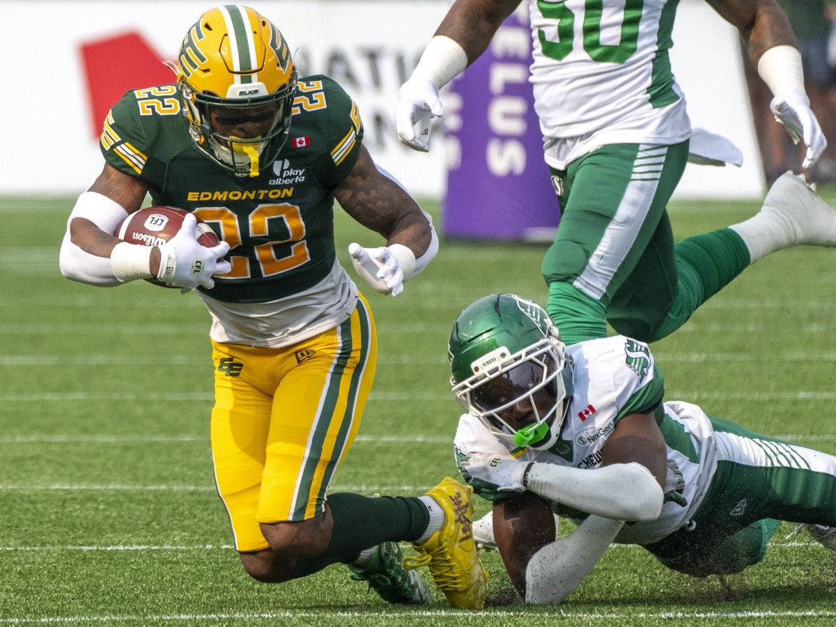 Edmonton Elks Javon Leake (22) is tackled during CFL action against the Saskatchewan Roughriders on Saturday, August 1, 2026 in Edmonton.