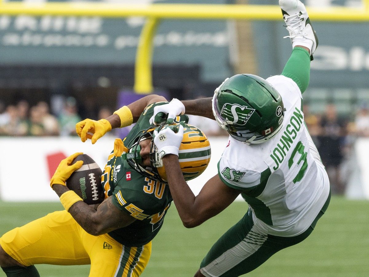 Edmonton Elks Tyrell Ford (30) makes an interception on Saskatchewan Roughriders KeeSean Johnson (3) during CFL action on Saturday, August 1, 2026 in Edmonton.