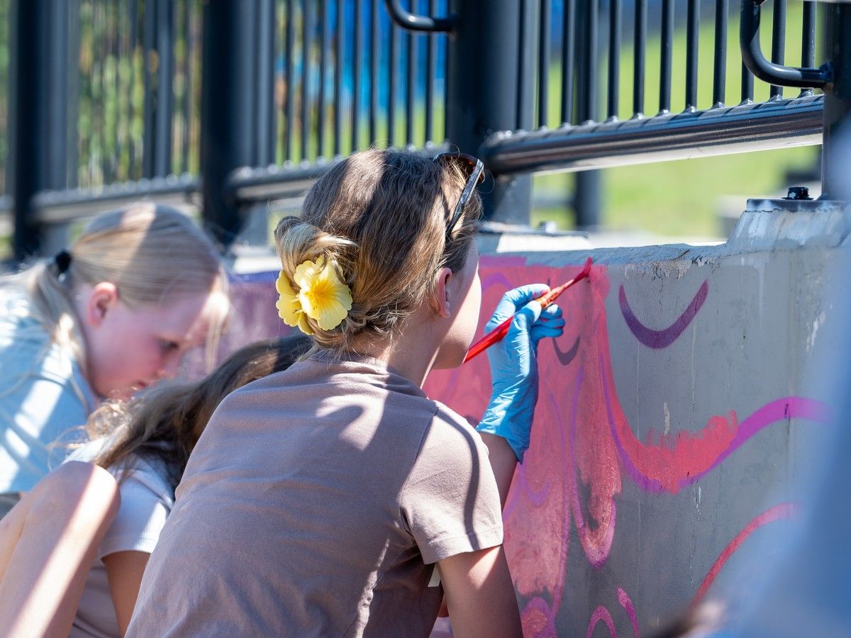 Students paint a mural led by artist Elsie Yanick. Fort McMurray, Alta. August 20, 2026. Photo provided by RMWB.