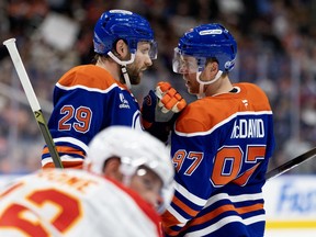 Edmonton Oilers forwards Leon Draisaitl and Connor McDavid talk things over during third period preseason NHL action against the Calgary Flames at Rogers Place in Edmonton on Saturday Sept. 26, 2026.