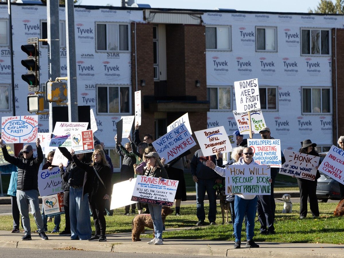 Edmontonians protest high-density, mid-block infill developments allowed under the city's zoning bylaws, at 149 St. and 87 Ave in Edmonton, Sunday Sept. 27, 2026. The protest was one of several city wide infill rallies held Sunday. Photo by David Bloom