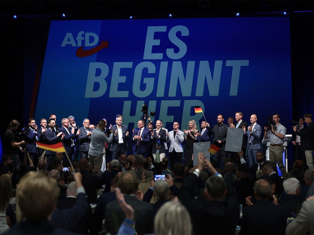 (C-LtoR) Ulrich Siegmund, far-right Alternative for Germany (AfD)'s main candidate in the Saxony-Anhalt state election, AfD co-leaders Tino Chrupalla and Alice Weidel and other party members sing the national anthem at the AfD's election party following Saxony-Anhalt's state elections in Magdeburg, eastern Germany on Sept. 6, 2026. Germany's far-right AfD won a landslide victory in a key regional election on Sept. 6 in the ex-communist east, according to exit polls, but it remain unclear whether it can win an absolute majority to govern.
