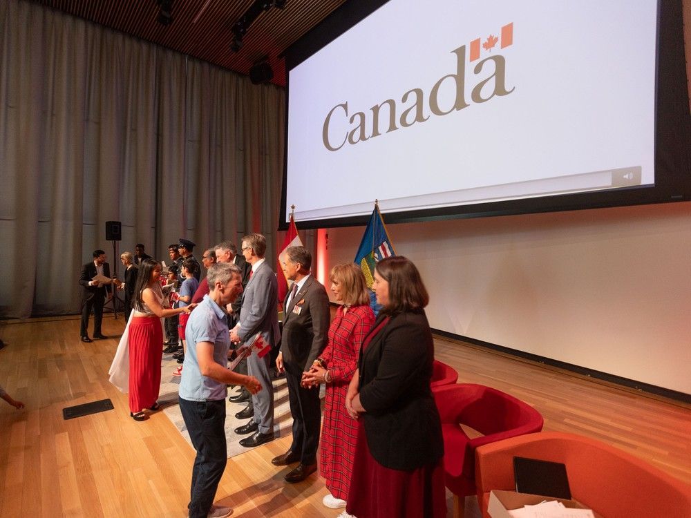 New Canadians receive their Canadian citizenship in a ceremony at the Calgary Central Library for Canada Day, Tuesday, July 1, 2025.