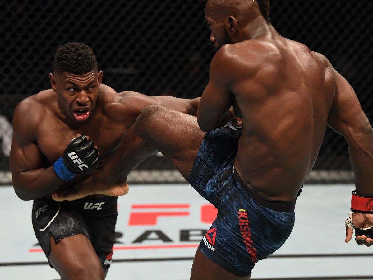 In this handout image provided by UFC, (L-R) Joaquin Buckley punches Impa Kasanganay in their middleweight bout during the UFC Fight Night event inside Flash Forum on UFC Fight Island on October 11, 2020 in Yas Island, Abu Dhabi, United Arab Emirates.
