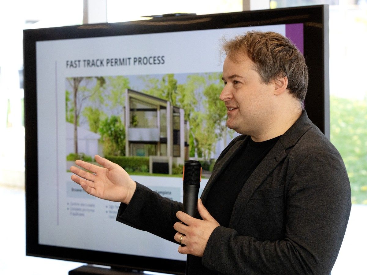 Greg Whistance-Smith, Project architect with City of Edmonton's Infrastructure Services leads a panel discussion about infill housing at Edmonton's Stanley Milner Library, Thursday Oct. 15, 2026. Photo by David Bloom