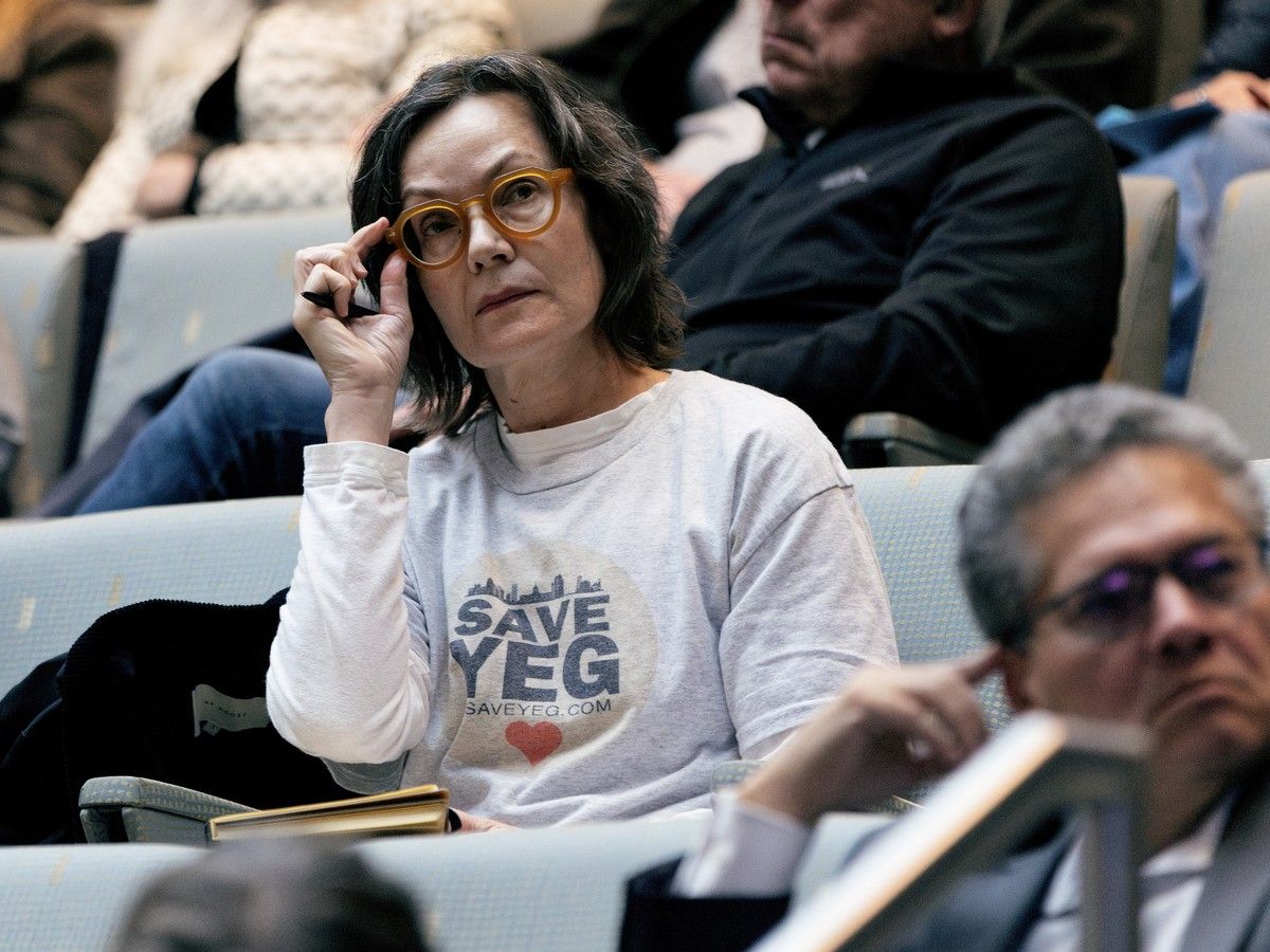 Edmontonians watch a special City Council meeting on infill, in Edmonton Friday Oct. 16, 2026.