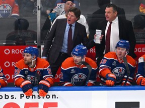 Head coach Mike Babcock and associate coach D.J. Smith of the Edmonton Oilers look on from the bench during the second period of the game against the Seattle Kraken at Rogers Place on October 3, 2026, in Edmonton, Alberta, Canada.