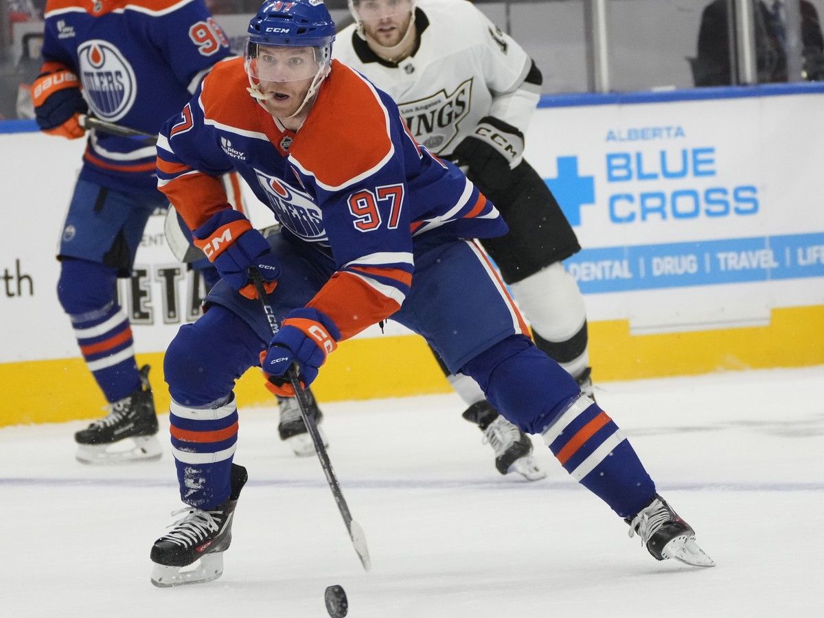 Edmonton Oilers Connor McDavid (97) moves with the puck against the Los Angeles Kings during first period NHL first round playoff action on Sunday, April 27, 2025 in Edmonton.