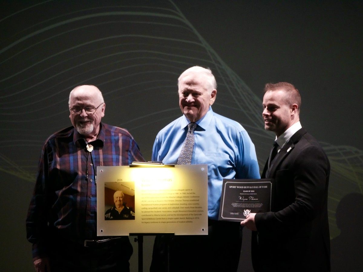 Wayne Thomas receives a plaque at the 2026 Sports Wood Buffalo Hall of Fame and Multi-Sports Award held at the Suncor Energy Centre for Performing Arts on Oct. 3, 2026.