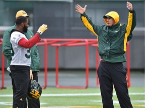 Eskimos head coach Jason Maas and running back C.J. Gable gesture to each other during practice at Commonwealth Stadium in Edmonton, October 25, 2017.