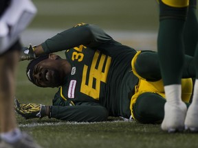 Edmonton Eskimos' Garry Peters is injured during action against the Calgary Stampeders on Sept. 9, 2017 in Edmonton.