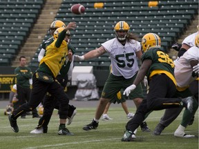 Mike Reilly (13) throws during the Edmonton Eskimos practice on Tuesday October 17, 2017 in Edmonton.