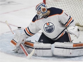 Edmonton Oilers goalie Laurent Brossoit lets a shot go wide from the Carolina Hurricanes during the first period of NHL pre-season action in Saskatoon, Sask. Wednesday, September 27, 2017.